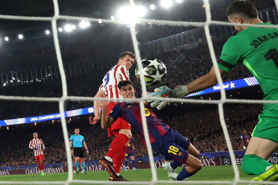 Atletico Madrid's Alexander Sorloth scores their second goal past Barcelona's Joan Garcia. Photo: Reuters/Albert Gea